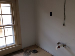 This photo of the bath, pre-linoleum, makes me smile with its smooth clean walls.